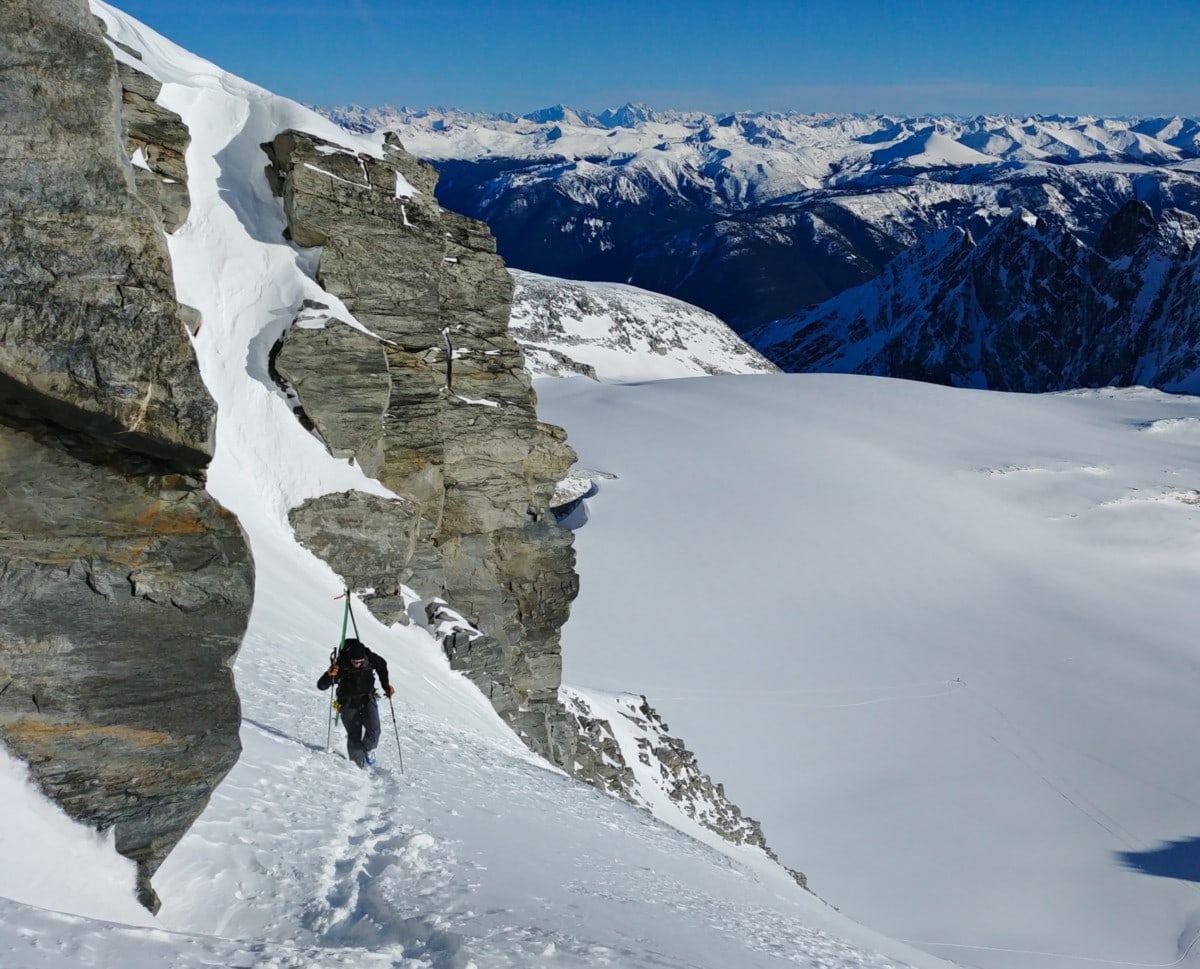 splitboarder climbing to rogers col