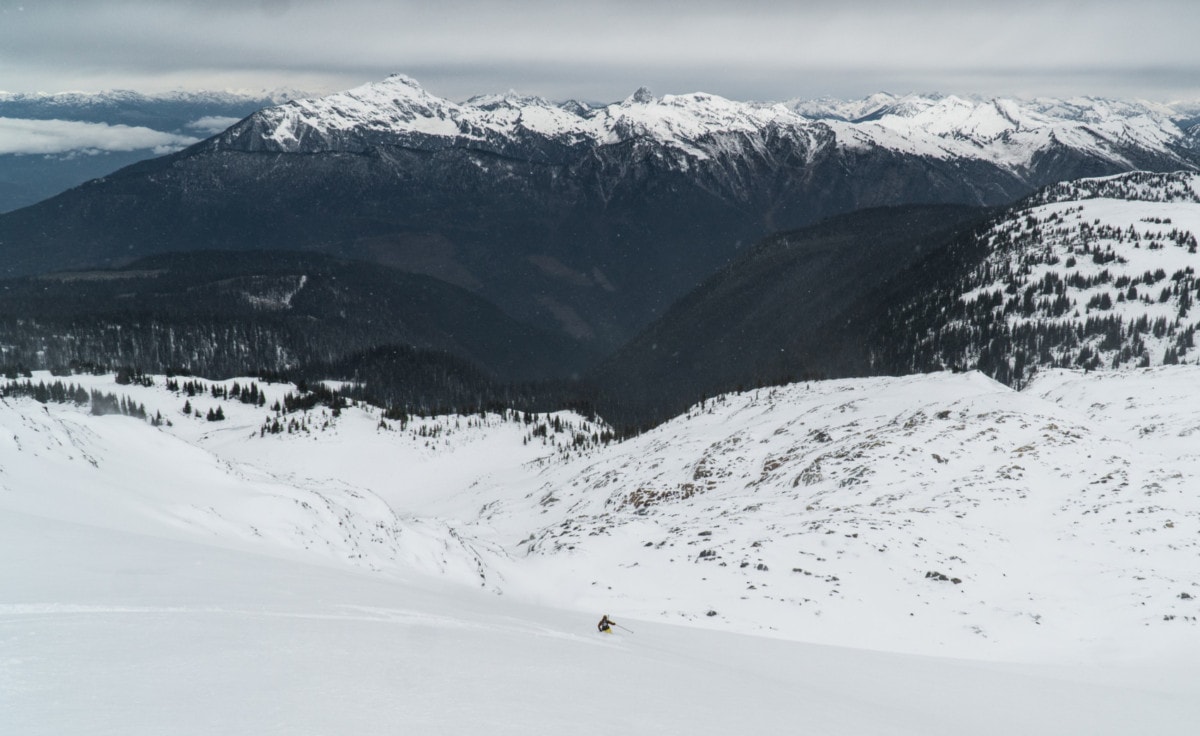 skier carving turns down the mccrae glacier