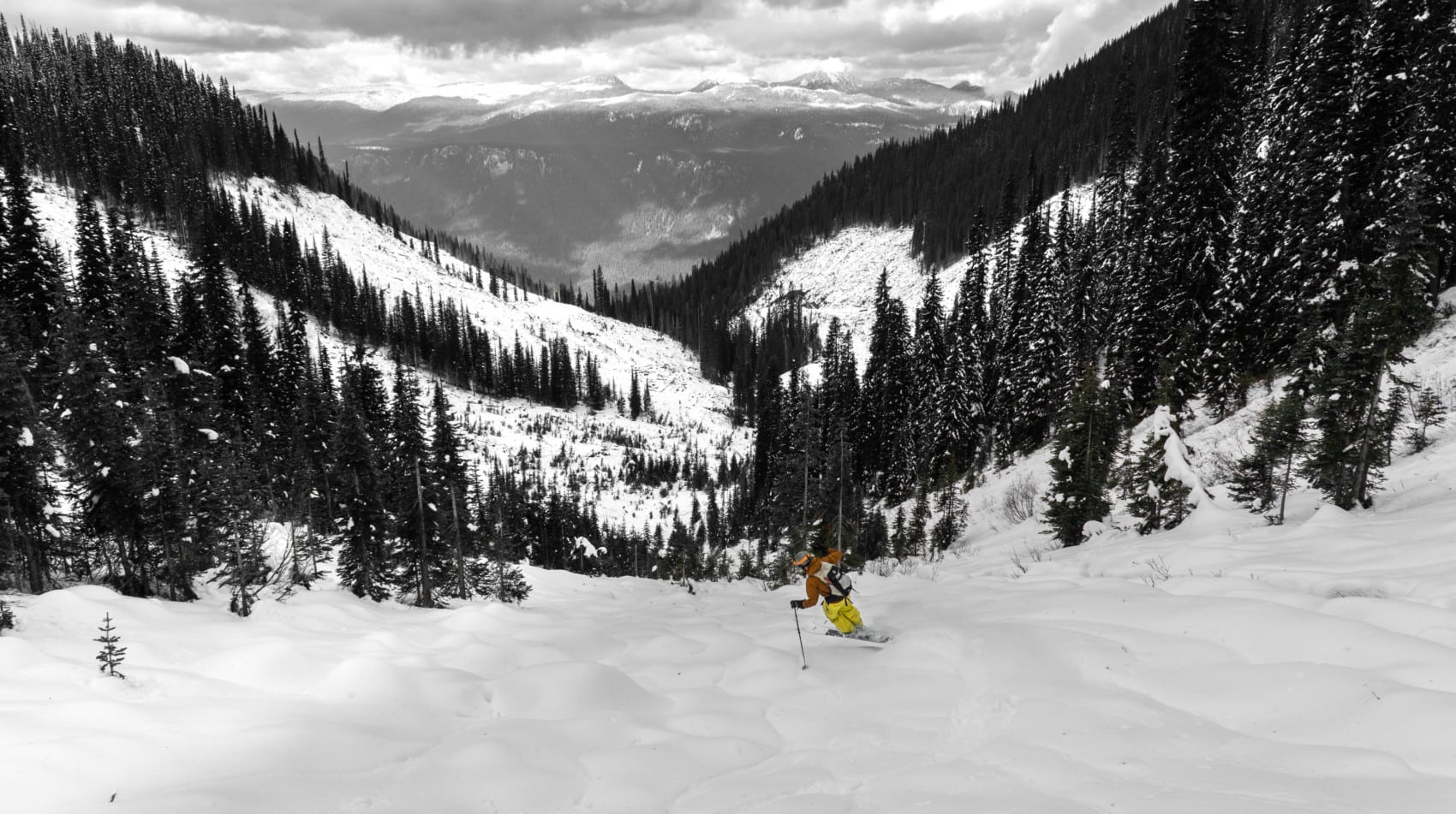 skier jumping around on a mellow slope