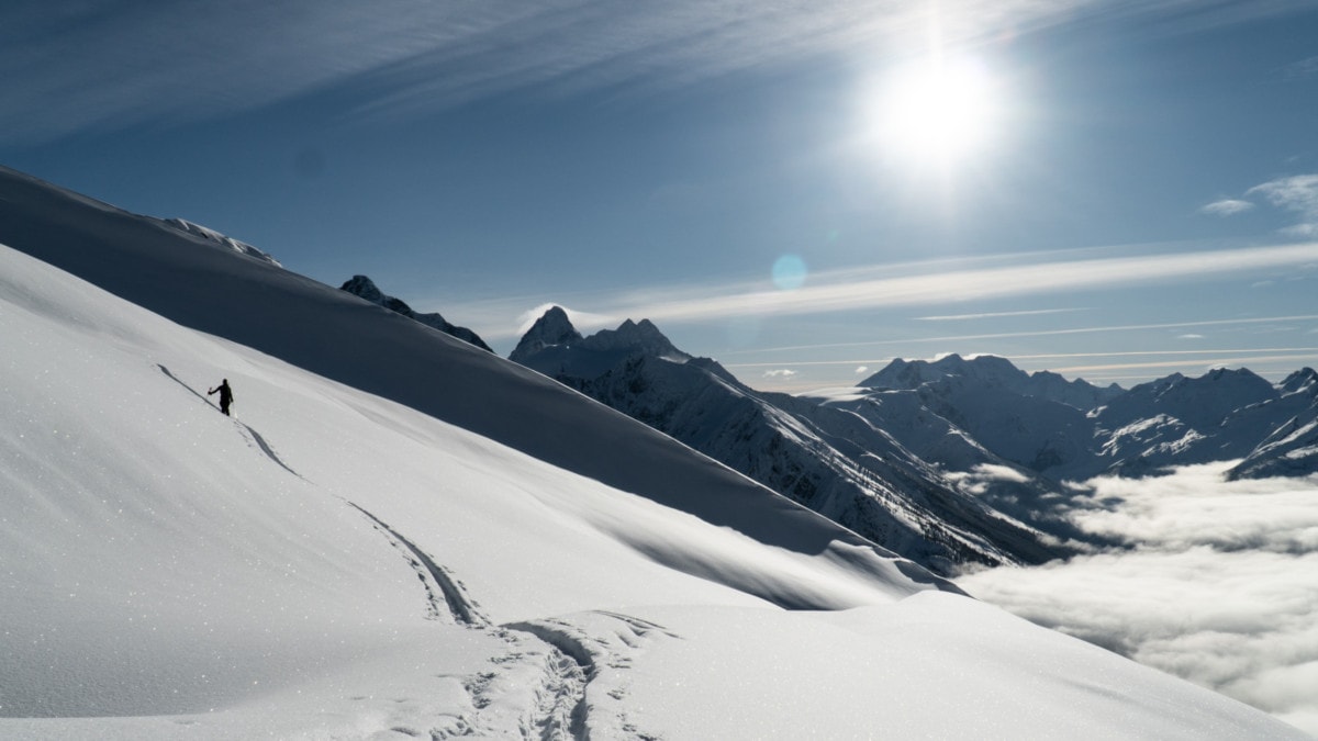 skier touring up the lizard moraine