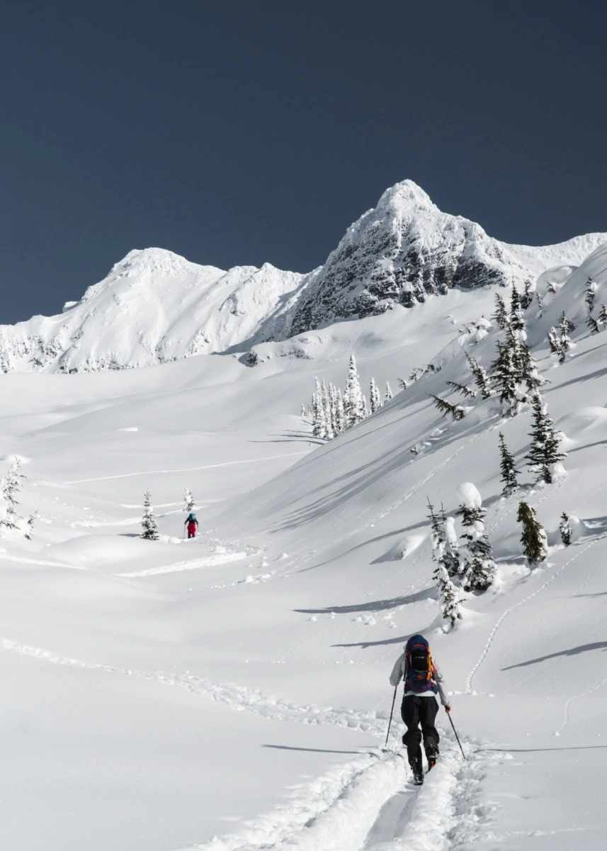 skier touring up avalanche bowl