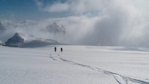 skiing down the fairy glacier lilliput mountain poking through the clouds