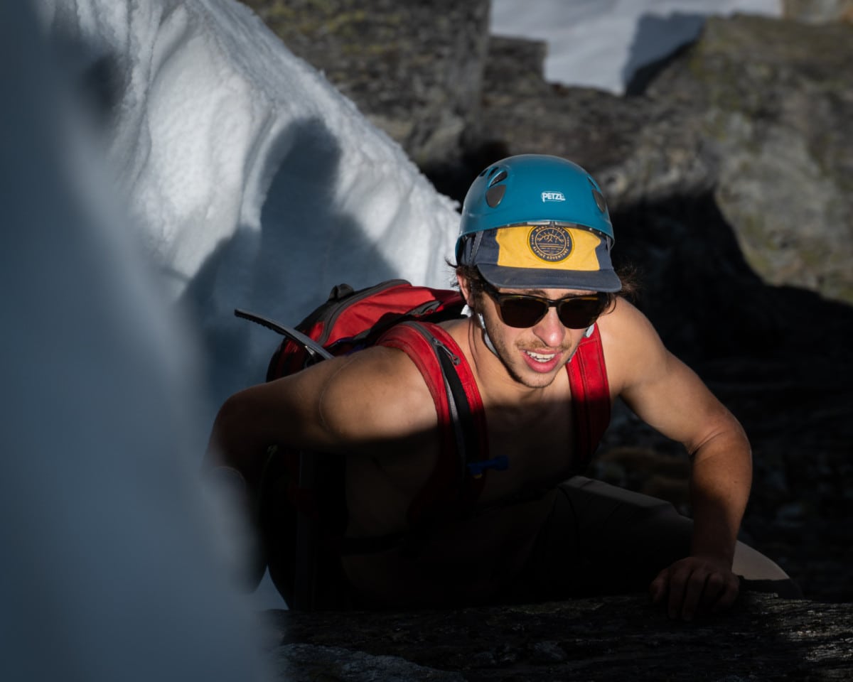 close up shot of climber next to snow