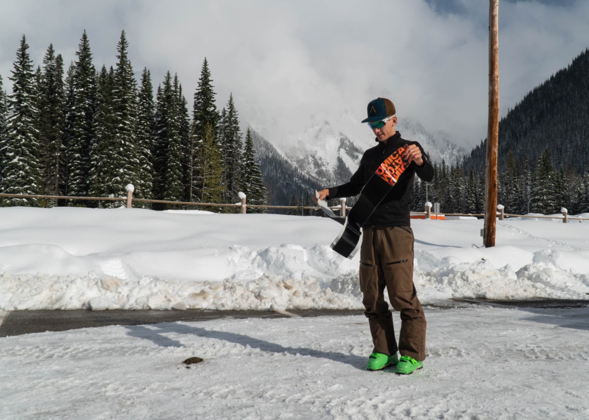 man removing skin saver from atomic climbing skins