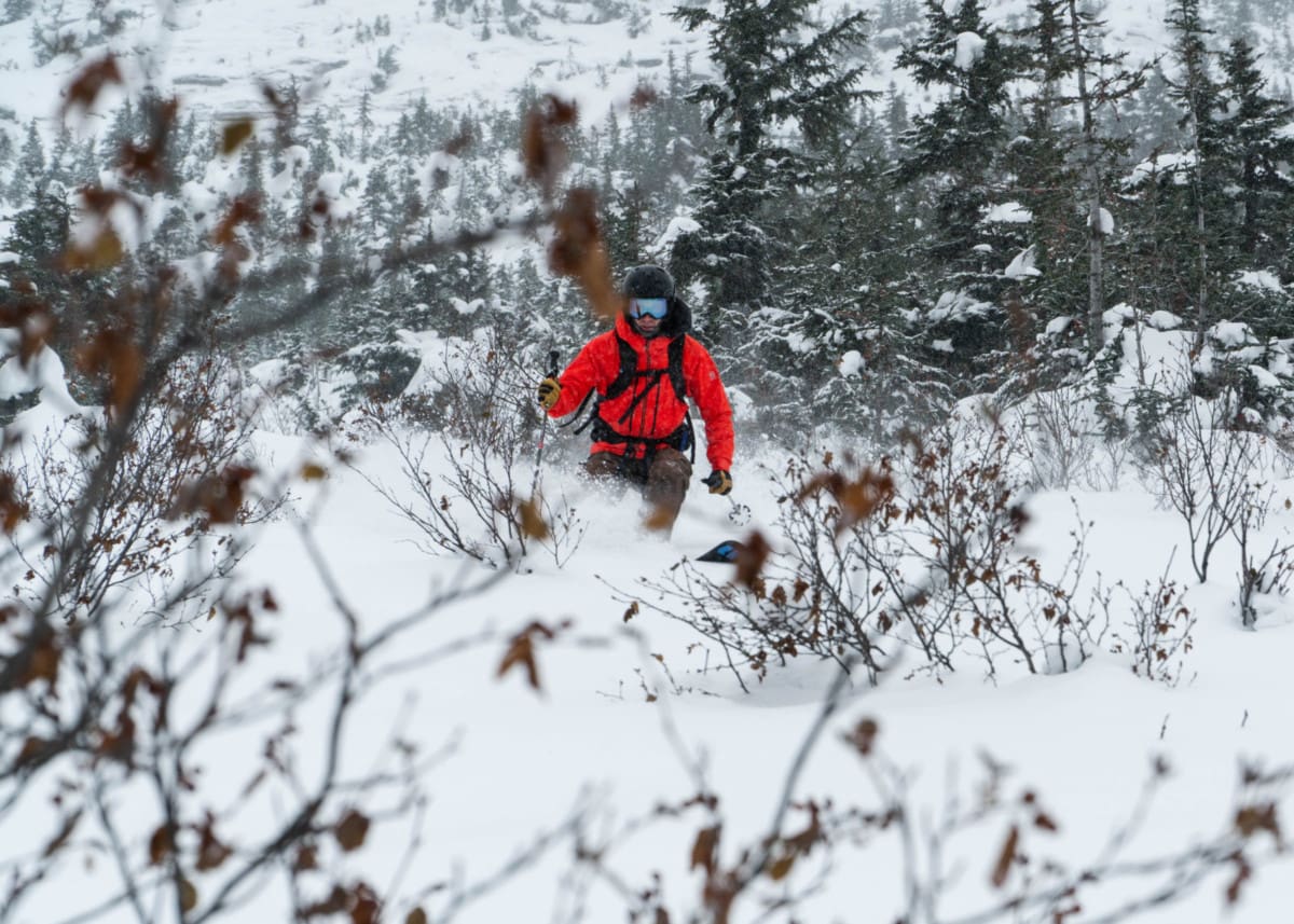 man skiing down the nrc slopes in october