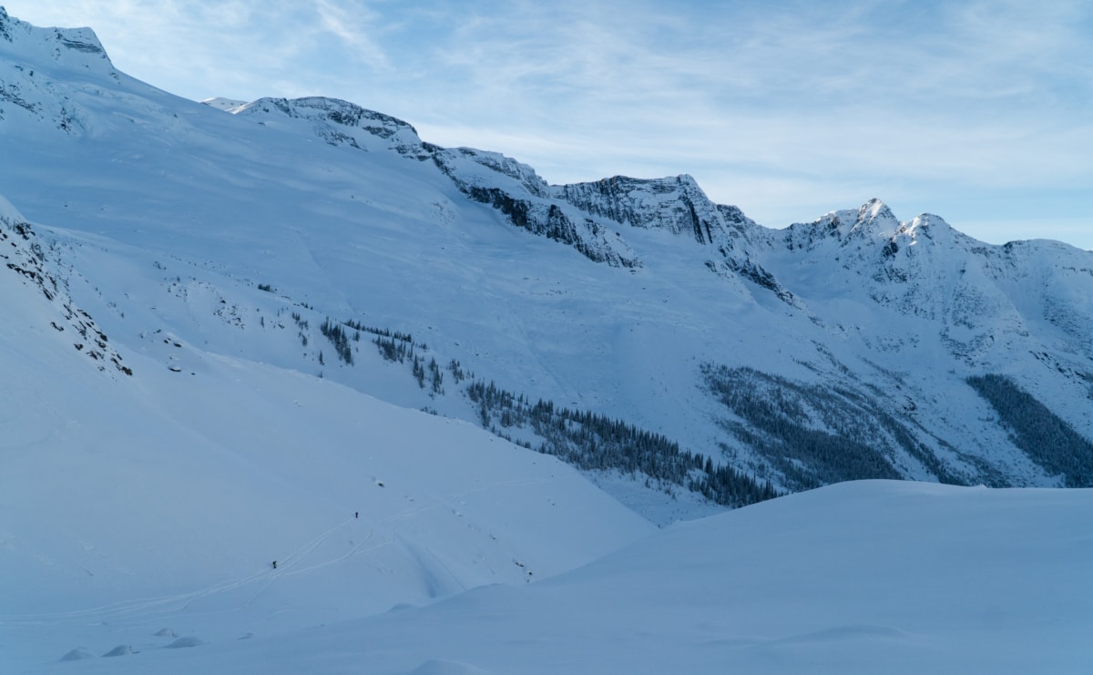 backcountry skiers skiing down the asulkan valley