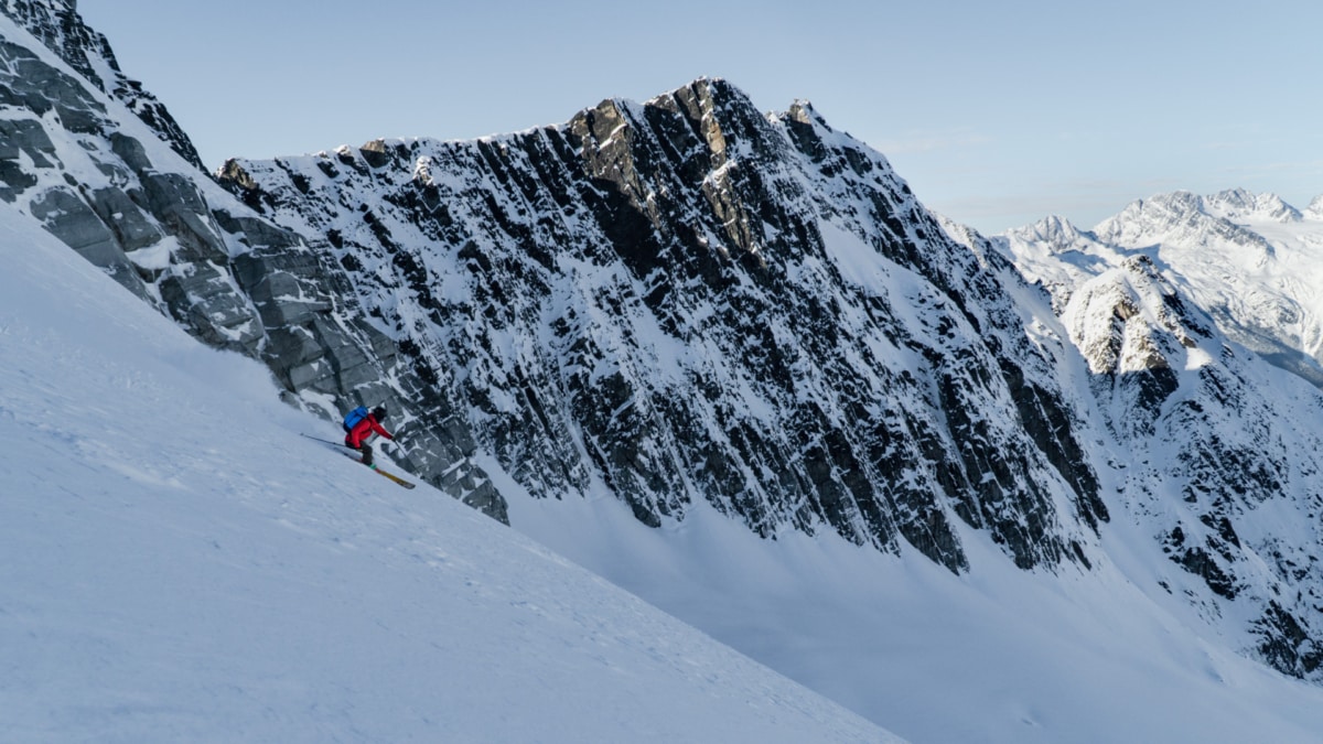 skier racing down a glacier