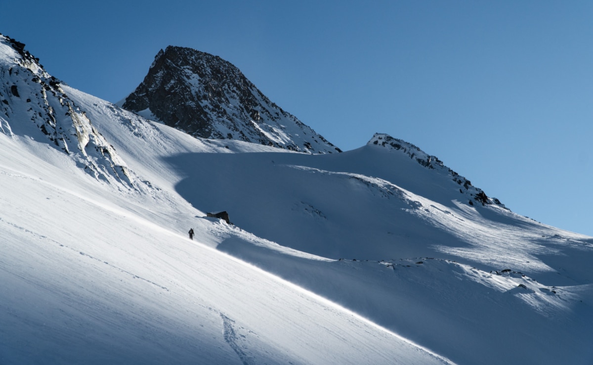 solo skier with the dome behind him