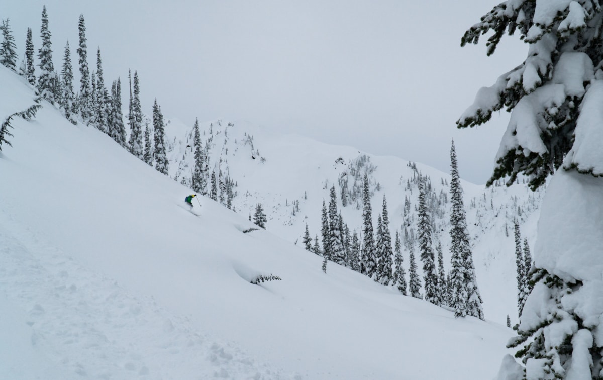 skier racing down a powdery slope near corbin peak