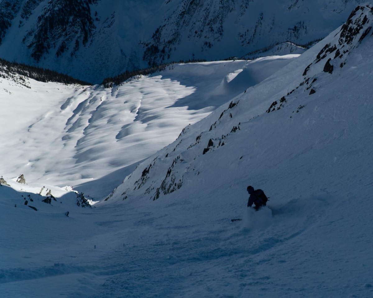 skier slashing a turn in the ursus minor se couloir