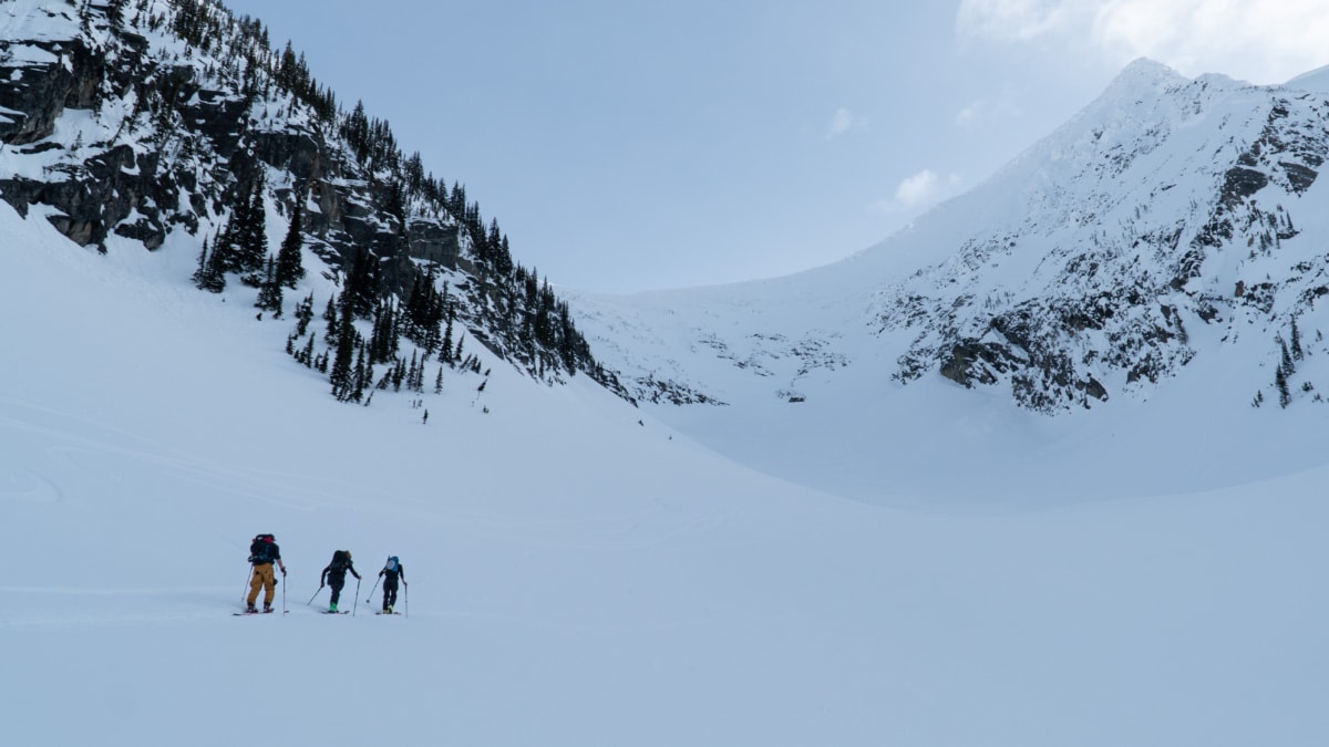 three skiers touring up the nrc gully to the nrc col