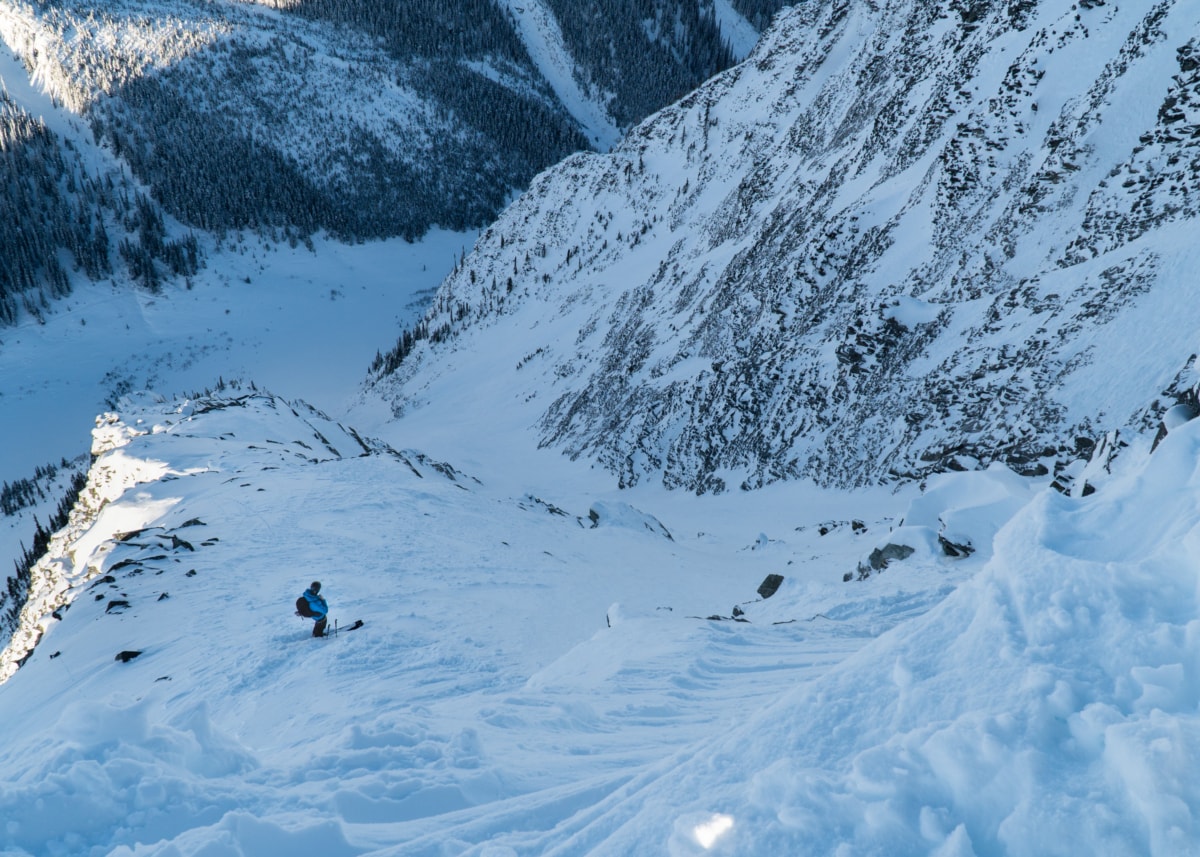 skier descending sts couloir from the lower entrance