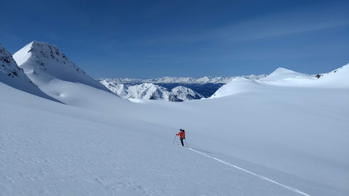 man gliding across the durrand glacier