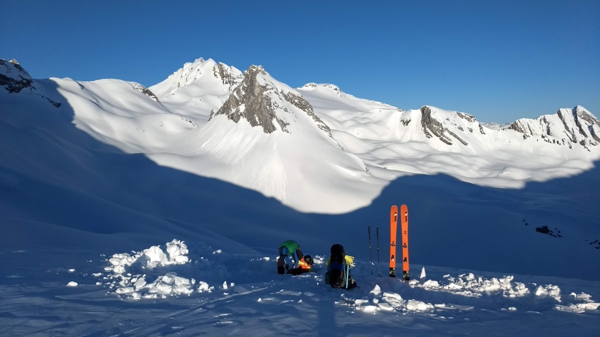 man tearing down camp at laforme col