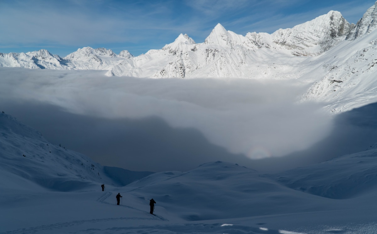 group of skiers heading up to lookout col