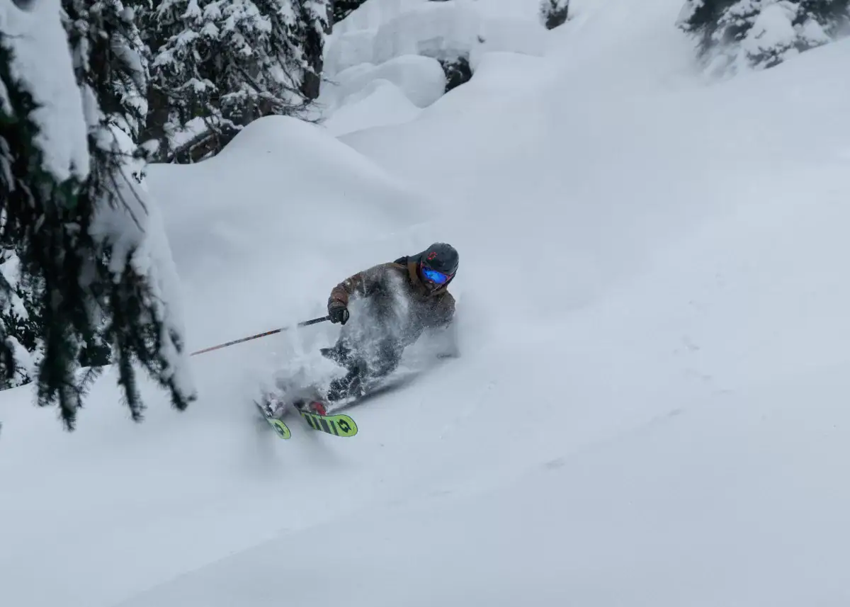 skier turning in deep powder