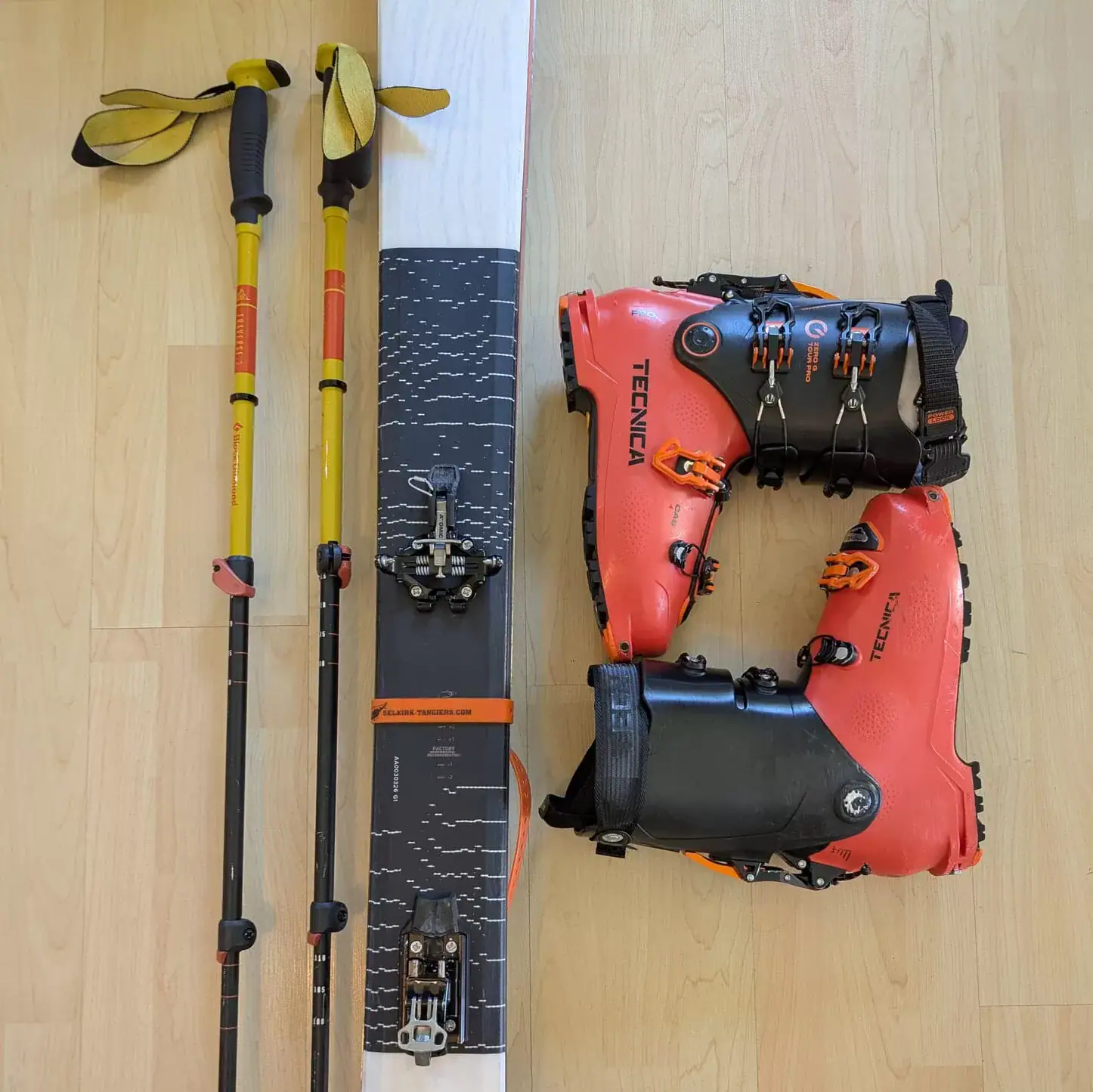 overhead shot of ski touring skis, boots and poles