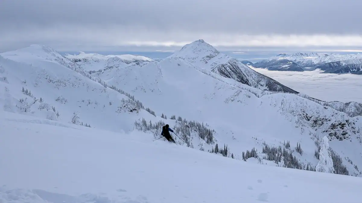 skier carving a turn on montana peak